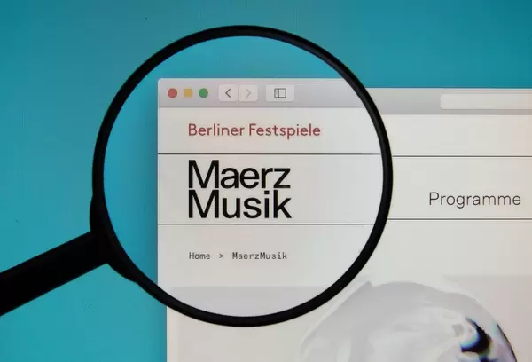 MaerzMusik logo on a computer screen with a magnifying glass