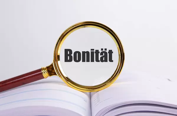 Magnifying glass and book with Bonität text