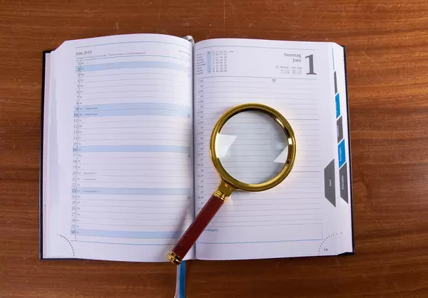 Magnifying glass and book