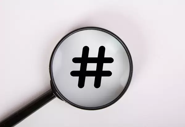 Magnifying glass with hashtag symbol