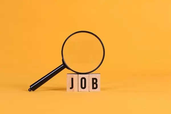 Magnifying glass with Job text on orange background