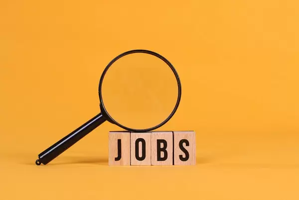 Magnifying glass with Jobs text on orange background