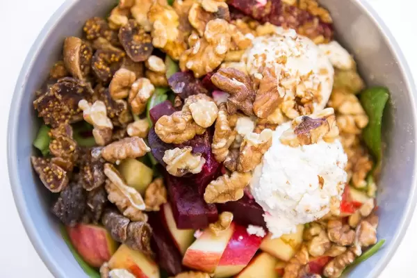 Make Food Goatlovers Bowl with goat cheese, dried figs, apple, beetroot, walnuts, spinach salad, pick salad and raspberry maple dressing