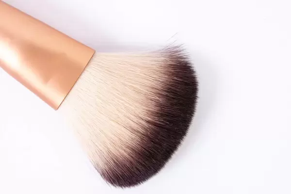 Makeup Brush above white background (Flip 2019)