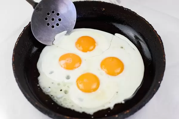 Making breakfast with fresh eggs