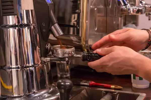 Making coffee with a professional coffee machine
