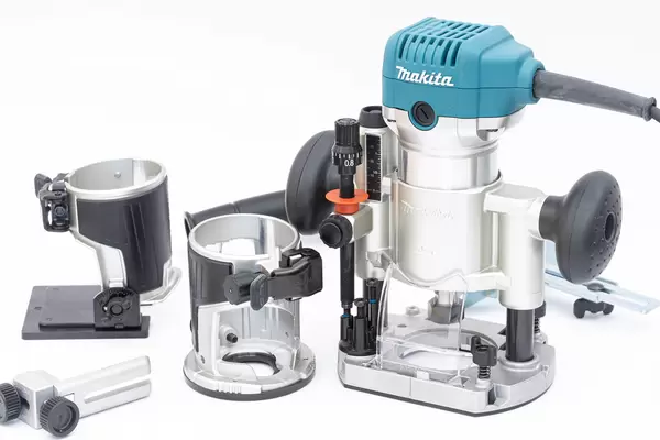 Makita Hand Router and equipment on the white background