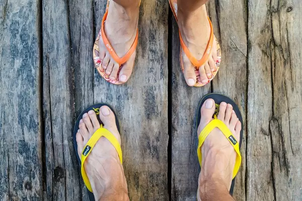 Male and female legs on the wooden floor  Flip 2019