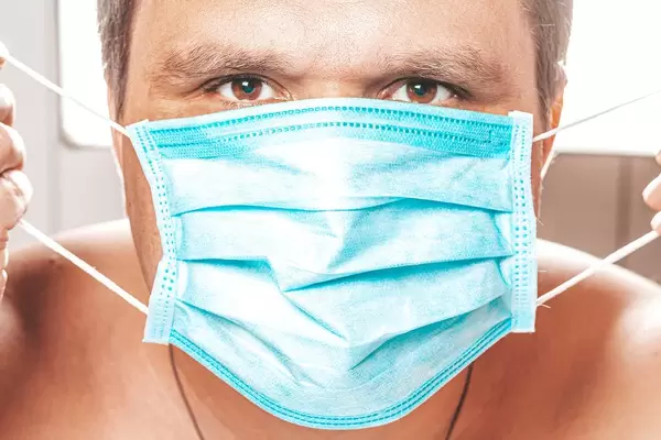 Male face with medical mask. The concept of prevention ill (Flip 2019)