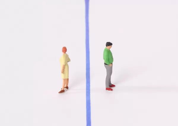 Man and woman with blue line between them