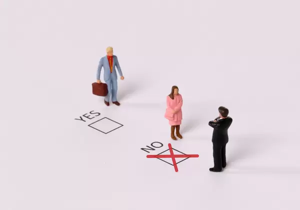 Man and Woman with Yes and No check boxes with red check mark in the No box