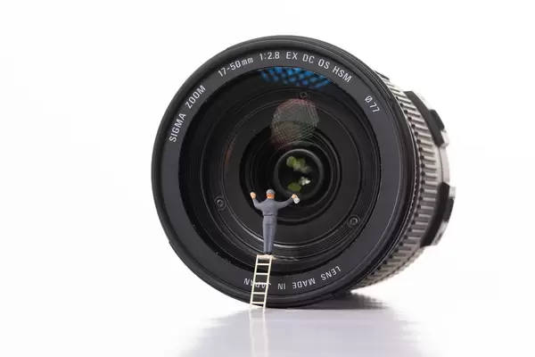 Man cleaning camera lens