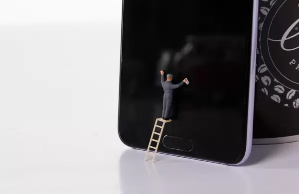 Man cleaning smartphone screen