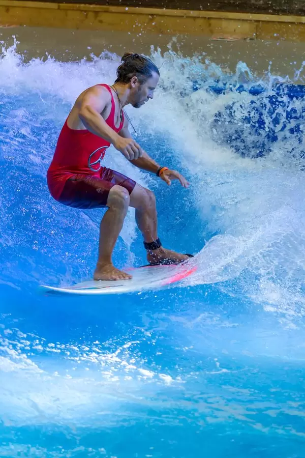 Man enjoying indoor surfing at fair Boot Düsseldorf 2018