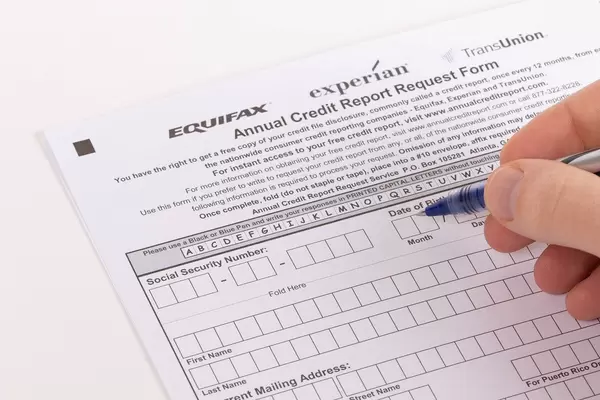 Man filling out Annual Credit Report Request Form