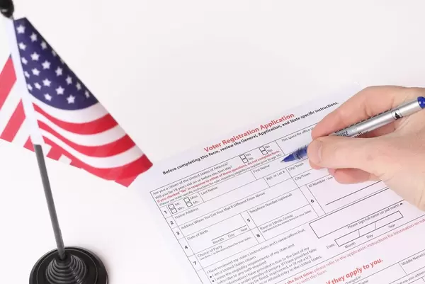 Man filling out Voter Registration Application