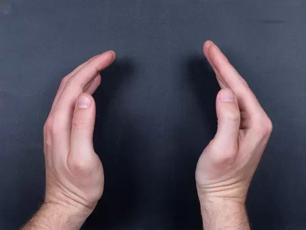 Man hands on black background with empy space