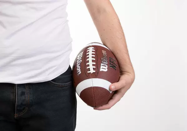 Man holding football ball