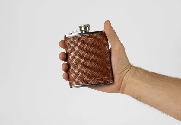 Man holding hip flask