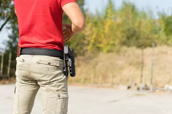Man in Red T-Shirt At The Shooting Range