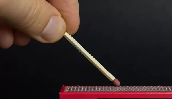 Man lighting a match