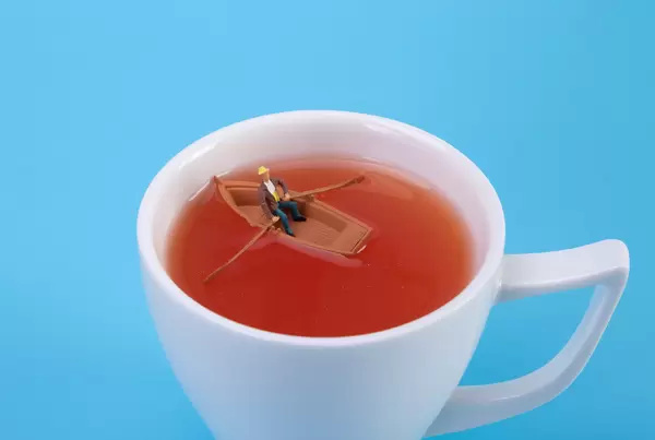 Man on a boat in a tea cup