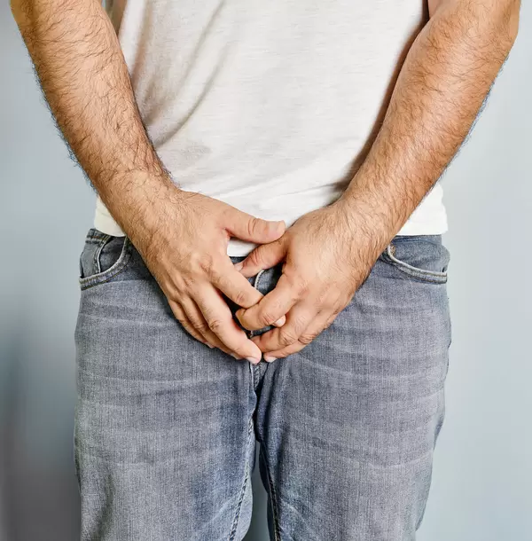 Man protecting his ballbag scrotum