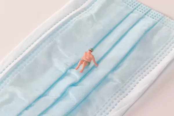 Man relaxing on medical face mask