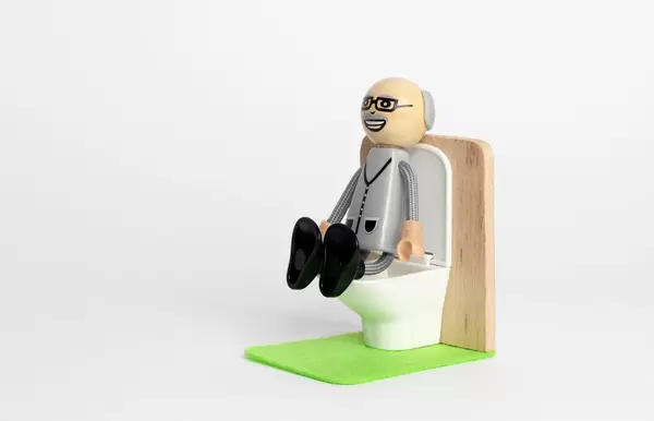 Man sitting on the toilet