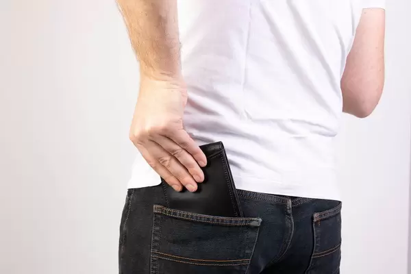 Man taking wallet from back pocket