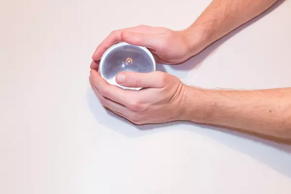 Man touching glass ball