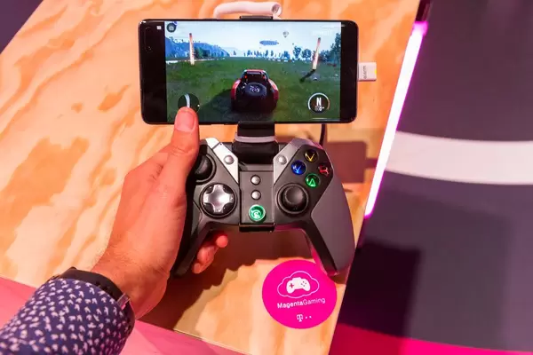 Man uses GameSir G4 Bluetooth Gamepad for Google Android Smartphones: multi-platform game controller for MagentaGaming