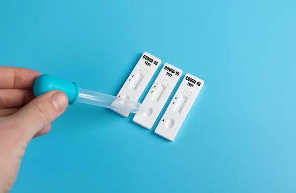 Man using a covid-19 rapid antigen test