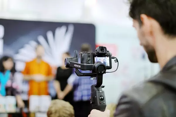 Man video recording using Ronin handheld stabilizer (Flip 2019)