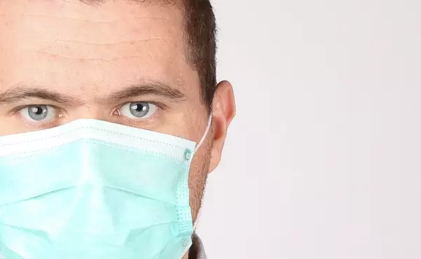 Man wearing face mask on white background