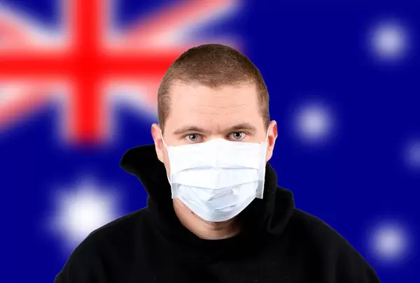 Man wearing protection face mask with flag of Australia