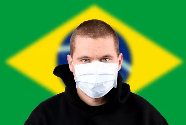 Man wearing protection face mask with flag of Brasil