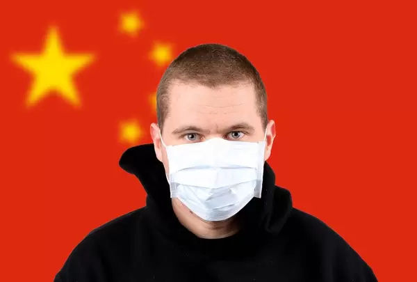 Man wearing protection face mask with flag of China