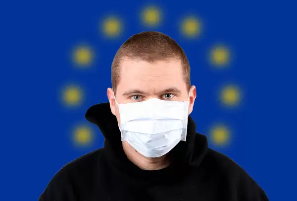 Man wearing protection face mask with flag of European Union