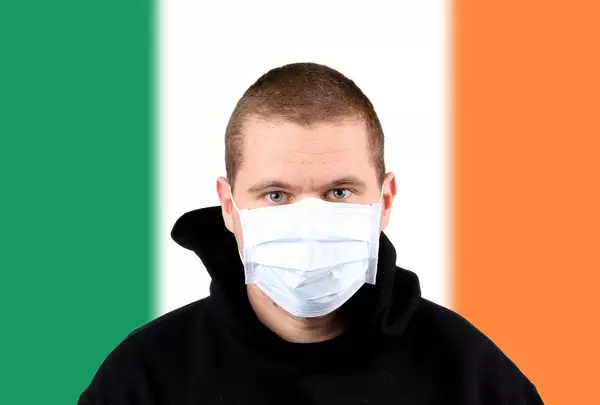 Man wearing protection face mask with flag of Ireland
