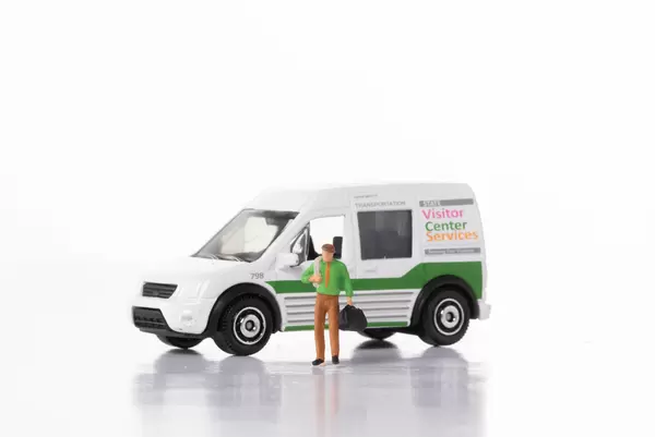 Man with delivery van on white background