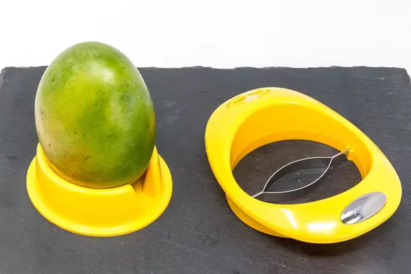 Mango Depitter with Mango on black slate plate
