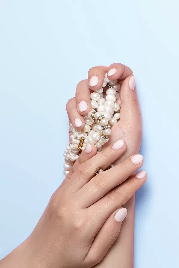 Manicure and beauty concept. Woman showing her beautiful manicure (Flip 2020)