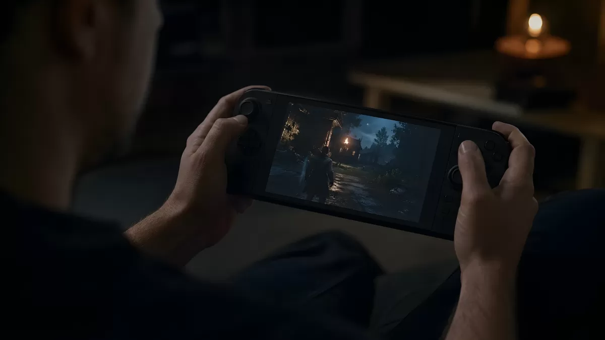 Mann spielt Horrorspiel auf tragbarer Spielkonsole