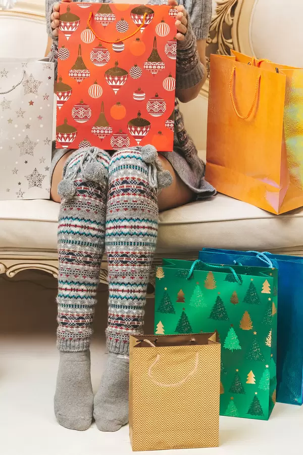 Many bags with purchases and female legs