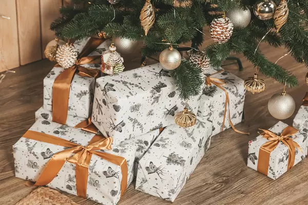 Many gifts under the decorated christmas tree