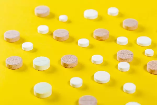 Many tablets on a yellow background