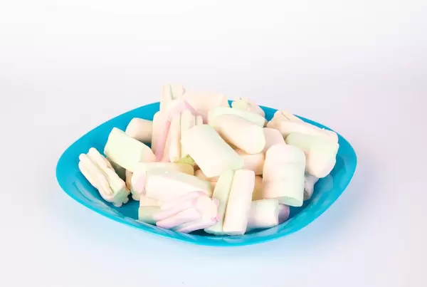 Marshmallows on a blue plate