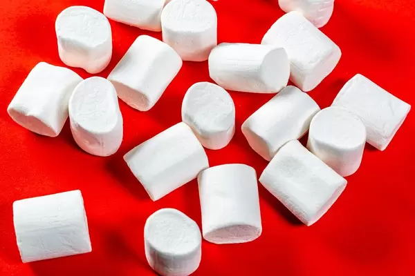 marshmallows on a red background. top view