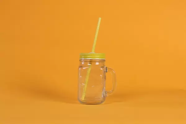 Mason jar on orange background